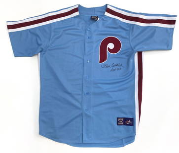 Steve Carlton - Baseball Hall of Famer - Autographed Philadelphia Phillies Cooperstown Collection: Details: Steve Carlton autographed Philadelphia Phillies Cooperstown Collection official Majestic XL jersey. Carlton has hand-signed in black felt tip marker adding a "HOF 94" inscription. In fine