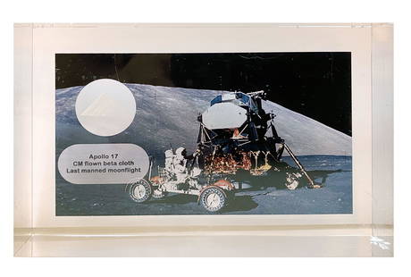 Apollo 17 - Eugene Cernan Flight Flown Beta Cloth Swatch in Florian Noller Acrylic Presentation: Apollo 17 flight flown beta cloth swatch relic display. The display includes a CM flown beta cloth swatch which was carried on board Apollo 17 by Eugene Cernan. The relic is