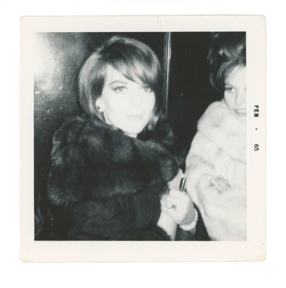 Natalie Wood – Hollywood Actress – Vintage 3.5 x 3.5" Candid Snapshot: Details: Natalie Wood vintage candid snapshot, 3.5 x 3.5, showing the actress elegantly dressed in a fur coat alongside a companion. The photo is date-stamped “FEB 65” along the border. Re