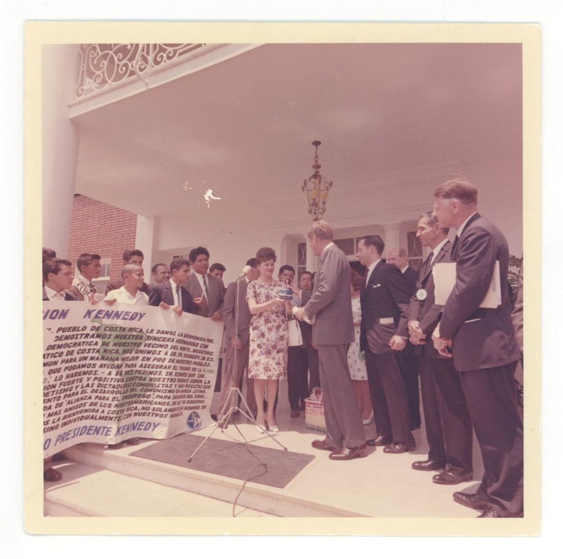 John F. Kennedy – White House Reception with Costa Rican Delegation – Original Cecil Sto: Details: John F. Kennedy original 5 × 5 inch color photograph taken by White House photographer Cecil W. Stoughton, depicting President Kennedy greeting members of a Costa Rican delegation