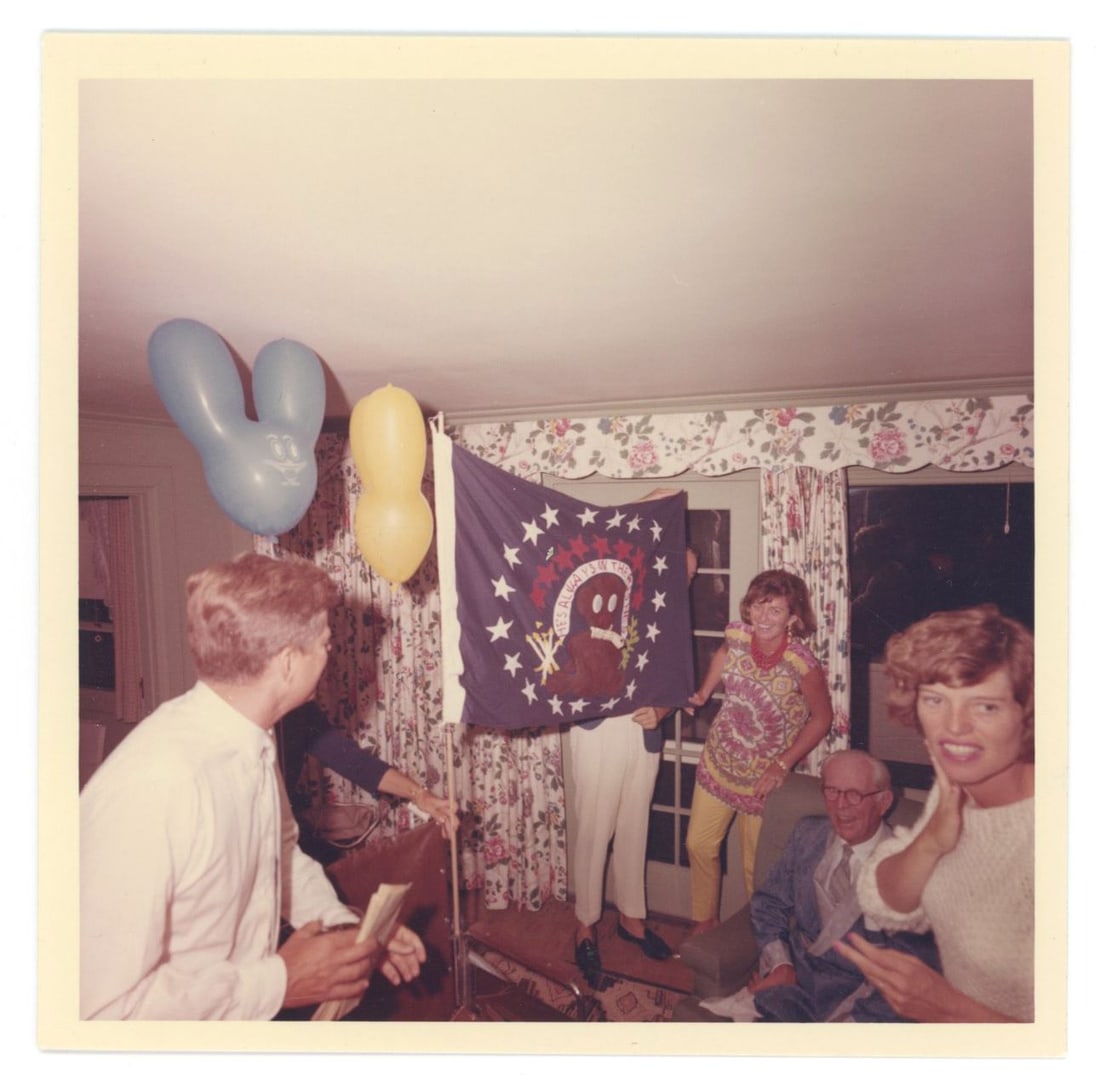 John F. Kennedy & Joe Kennedy Sr. & Family – Birthday Celebration – Cecil Stoughton 5 &#: Details: John F. Kennedy pictured with Joseph P. Kennedy Sr. and members of the Kennedy family in an original 5 × 5 inch photograph documenting a birthday celebration. The image was taken by Ceci