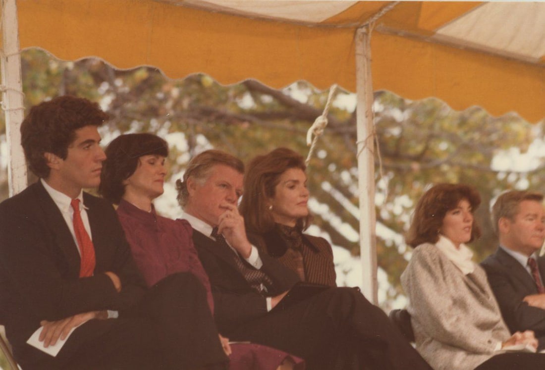 John F. Kennedy Jr. & Jackie Kennedy – Original 5 x 3.5” Candid Photo – Peter Warr: Details: John F. Kennedy Jr., Jacqueline Kennedy Onassis, Ted Kennedy, Caroline Kennedy and Kitty Dukakis are seen seated together at a public event in this vibrant original 5 x 3.5”