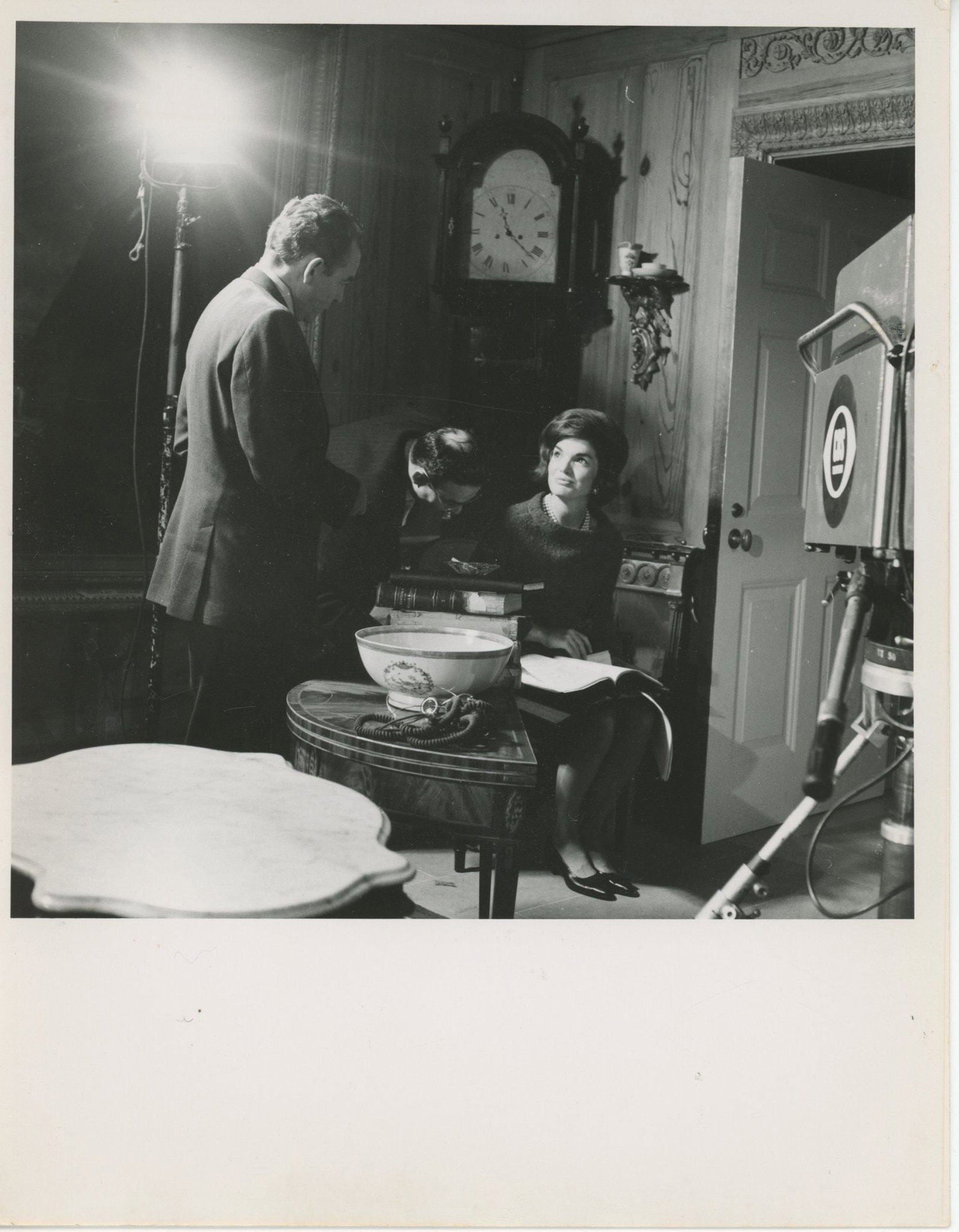 Jacqueline Kennedy "A Tour of the White House with Mrs. John F. Kennedy" 7 x 9" Original Press Photo: Details: Jacqueline Kennedy original 7 x 9 inch black-and-white press photograph depicting the First Lady during preparations for “A Tour of the White House with Mrs. John F. Kennedy.”