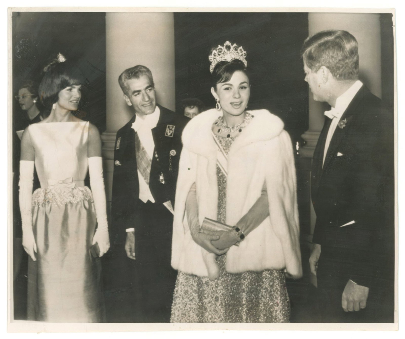 John F. Kennedy & Jacqueline Kennedy – Original 1962 White House State Dinner Photograph ̵: Details: John F. Kennedy and Jacqueline Kennedy vintage original 8.5 x 7" Associated Press wire photograph depicting the President and First Lady greeting the Shah of Iran, Mohammad Reza Pahlavi, and