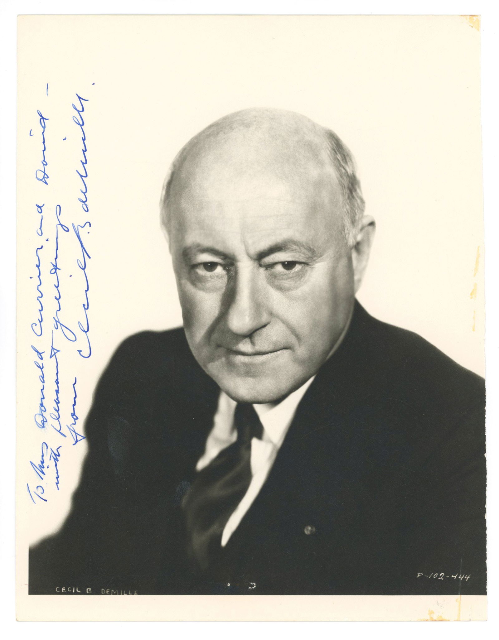 Cecil B. DeMille – Legendary Film Director – Autographed Photograph w/ 1958 Paramount Le: Details: Cecil B. DeMille autographed 7.75 x 10” black and white portrait photograph depicting the famed Hollywood director. The photograph is inscribed vertically in blue ink along the left