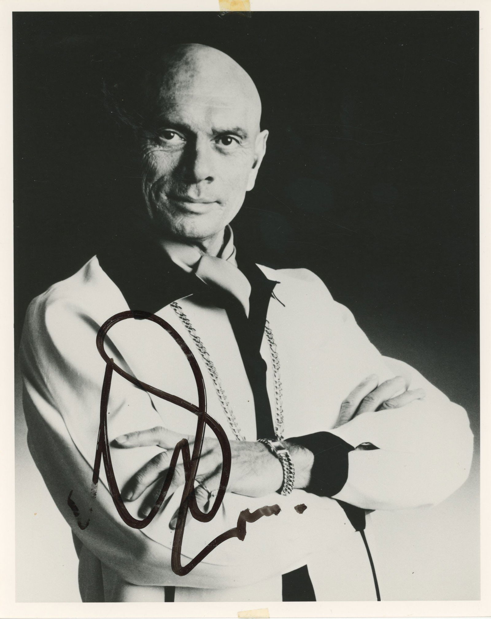 Yul Brynner – Academy Award-Winning Actor – Autographed 8 x 10" Photograph: Details: Yul Brynner autographed black and white 8 x 10" portrait photograph in dark marker across the lower portion of the image. Fine condition. Yul Brynner (1920–1985) was a