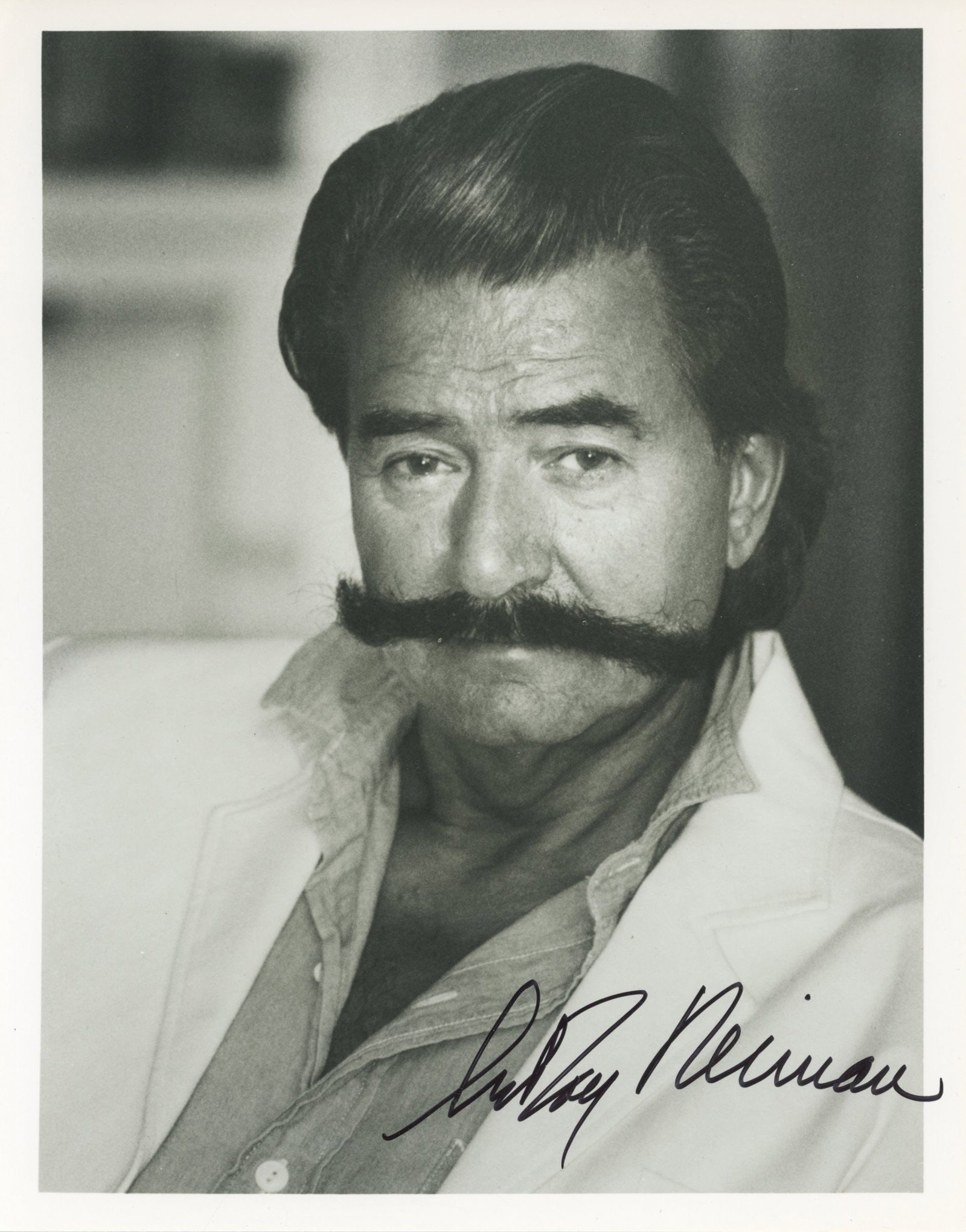 LeRoy Neiman – Sports & Pop Artist – Autographed 8 x 10” Photograph: Details: LeRoy Neiman black and white 8 x 10” portrait photograph, autographed in black felt-tip. Fine condition.LeRoy Neiman (1921–2012) was an American artist best known for his