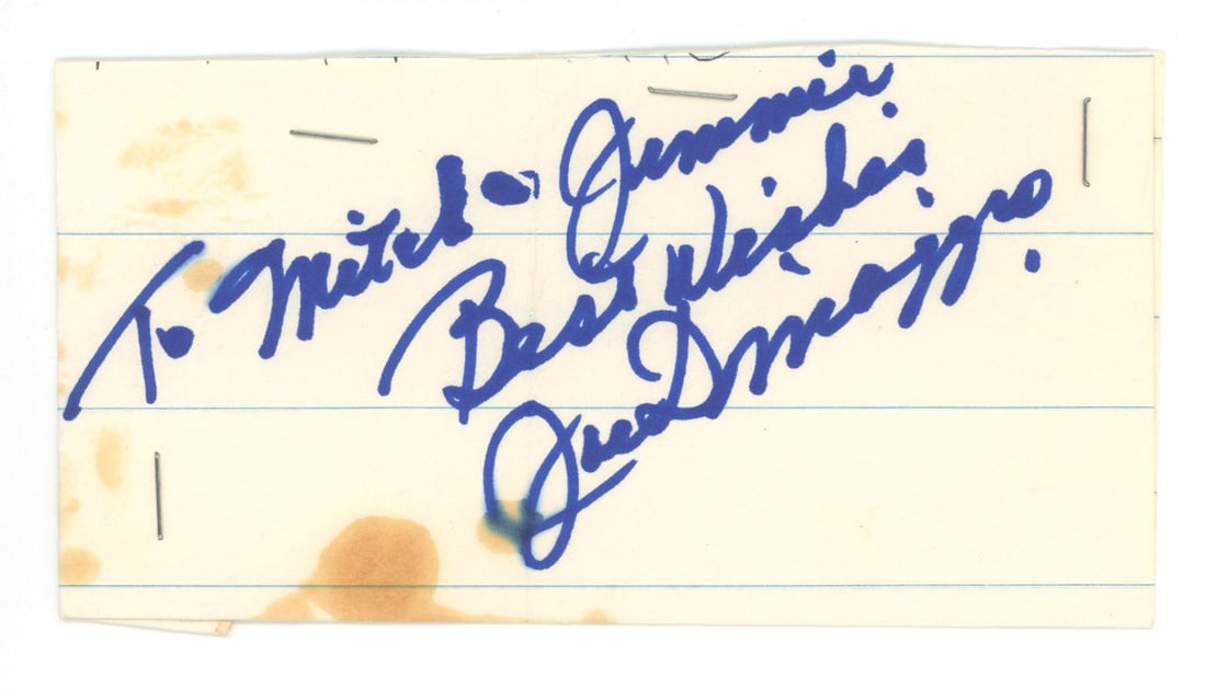 Joe DiMaggio – New York Yankees Hall of Famer –6 x 3.25" Cut Signature: Details: Joe DiMaggio autographed cut signature measuring approximately 6 x 3.25 inches, signed in blue ink on lined paper.Scattered staining, toning, staples at corners and edges, edge wear, and