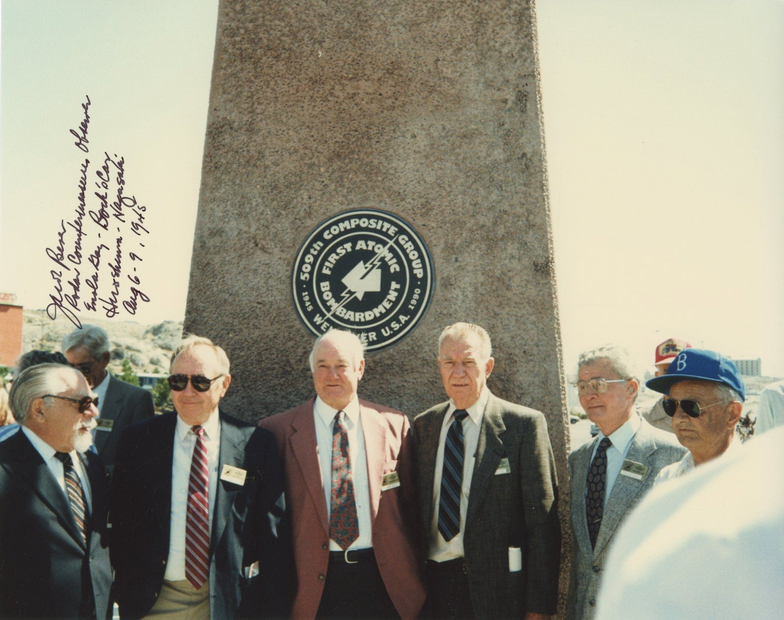 Jacob Beser – Enola Gay & Bockscar Crew Member – Autographed 10 x 8” Reunion Photo: Details: Jacob Beser autographed 10 x 8” color glossy photograph depicting a reunion of the 509th Composite Group veterans gathered at the First Atomic Bombardment memorial. Beser has boldly