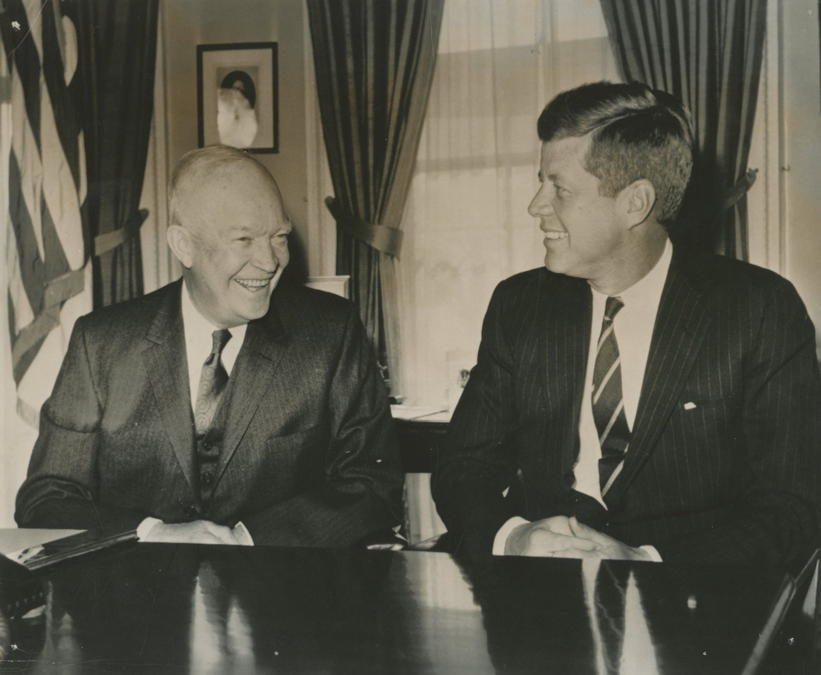 John F. Kennedy & Dwight D. Eisenhower – White House Meeting – Original Press Photo R: Details: John F. Kennedy and Dwight D. Eisenhower original 8 x 6.75” black-and-white press photograph capturing the president-elect and outgoing president seated together at the White House