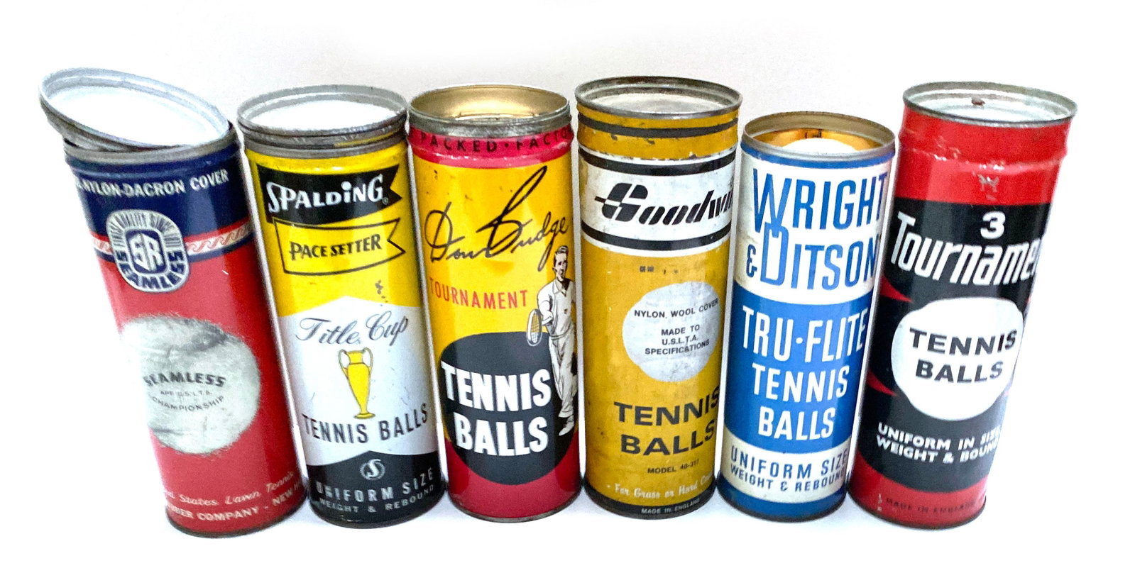 Vintage Tennis Ball Can Collection - Six Mid-Century Advertising Cans: Details: Group of six vintage tennis ball cans from American and English sporting goods manufacturers, including a Seamless Championship can by the United States Lawn Tennis Rubber Company, a