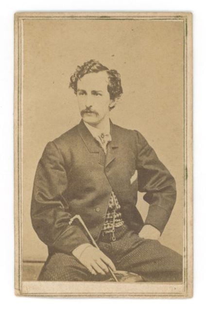 Abraham Lincoln Assassin John Wilkes Booth - Carte de Visite Photograph - Boston Backmark: Details: John Wilkes Booth Carte de Visite Photograph, a nineteenth-century albumen portrait depicting the famed actor and future assassin of President Abraham Lincoln seated in a studio pose. The rev