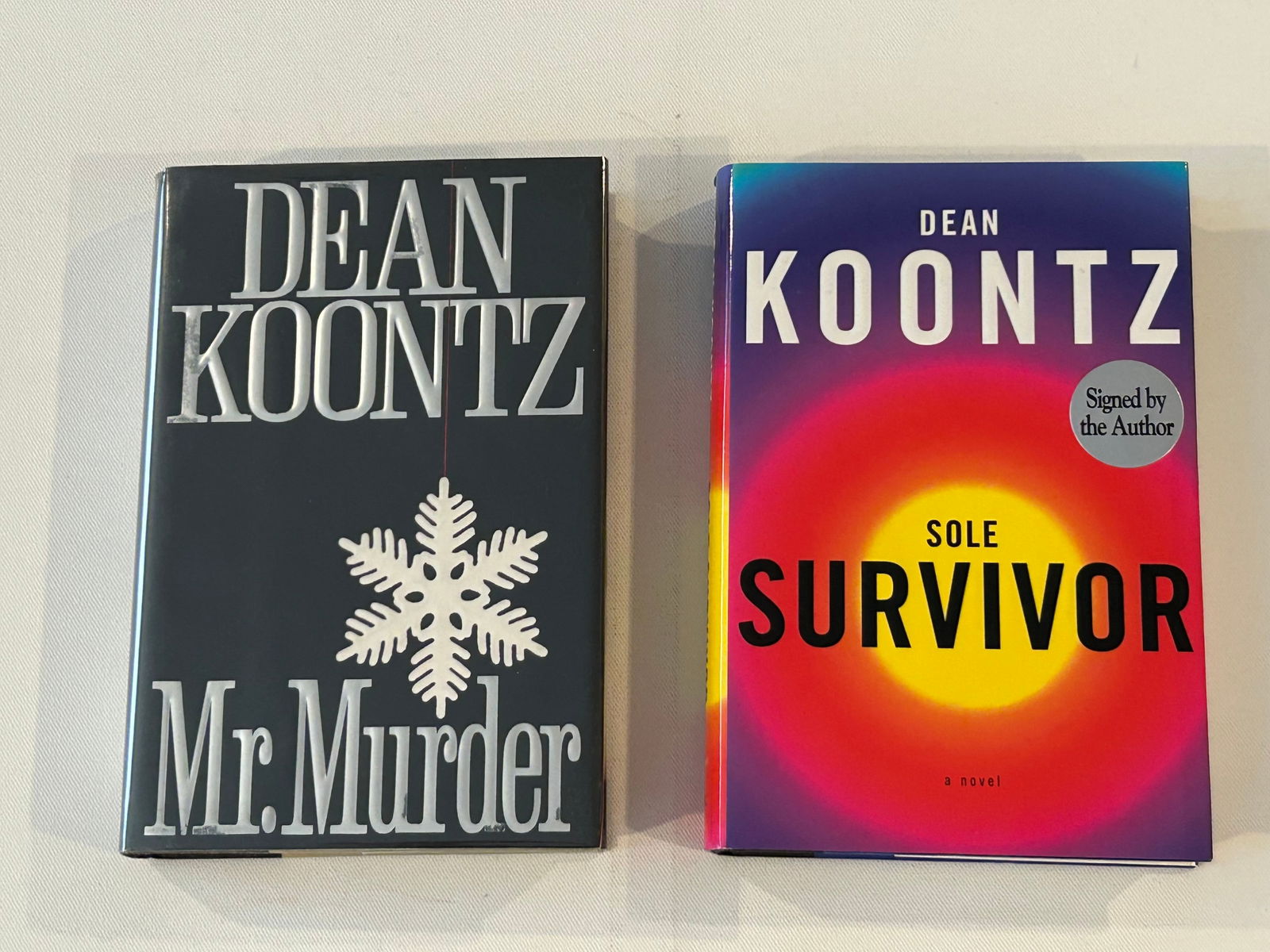 Dean Koontz SIGNED First Editions: Mr. Murder SIGNED First Edition published by G. P. Putnam's Sons, New York, 1993. Sole Survivor SIGNED First Edition published by Alfred A. Knopf, New York, 1997. Dimensions: 11" x 9" x 6"