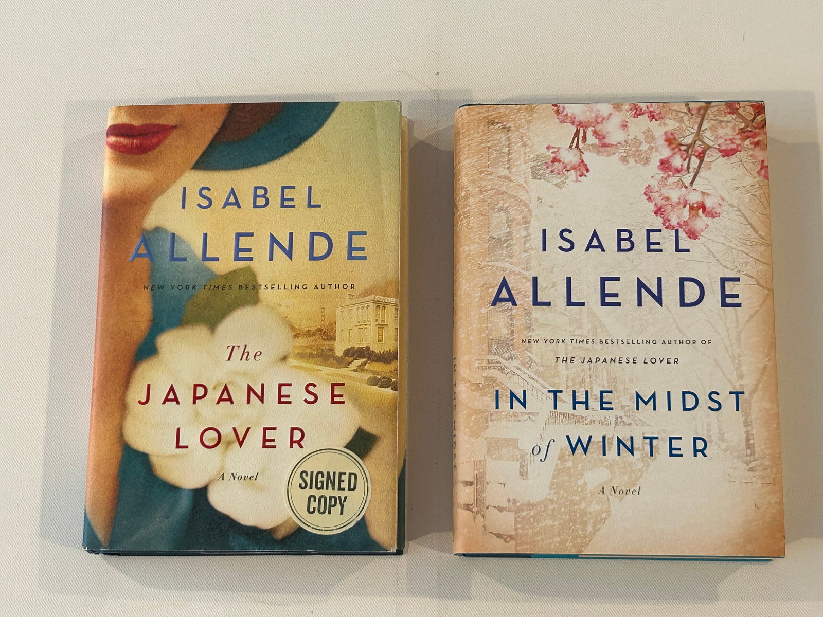 Isabel Allende SIGNED First Editions: The Japanese Lover & In The Midst Of Winter SIGNED First Editions published by Atria Books, New York, 2015, 2017. Dimensions: 11" x 9" x 6"