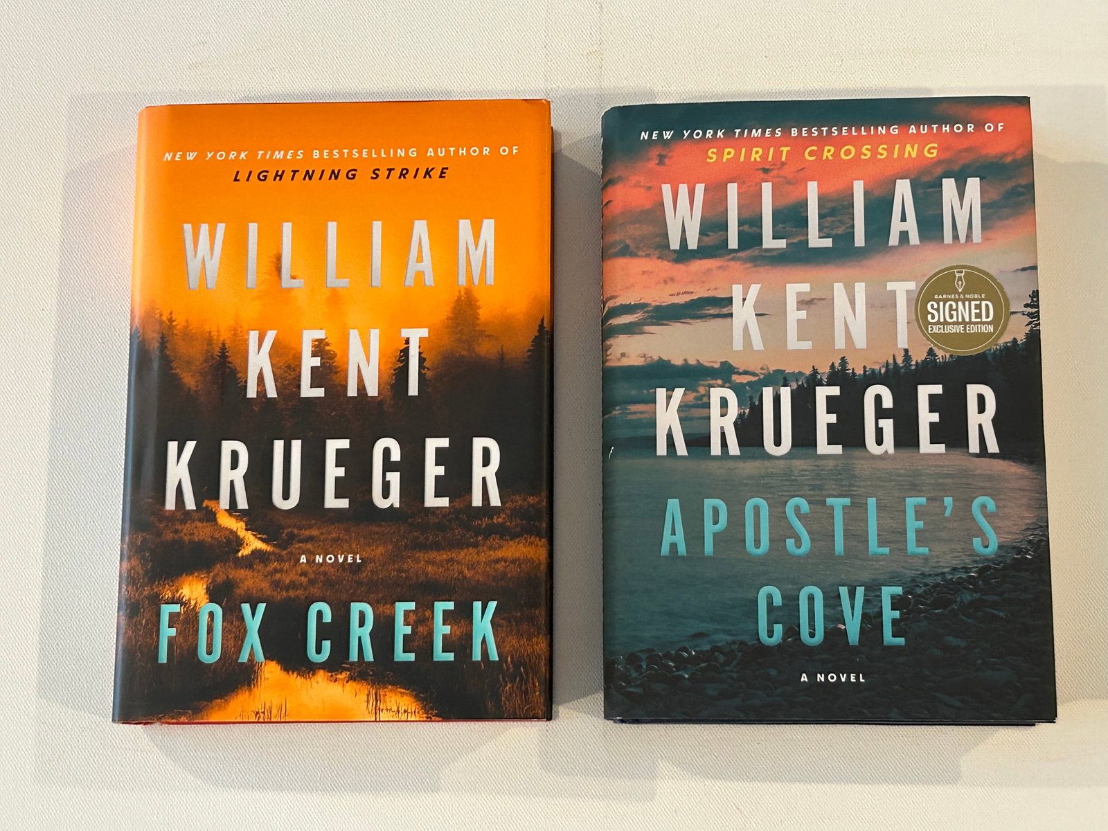 William Kent Krueger SIGNED First Editions: Fox Creek & Apostles Cove By SIGNED First Editions published by Atria Books, New York, 2022, 2025. Dimensions: 11" x 9" x 5"
