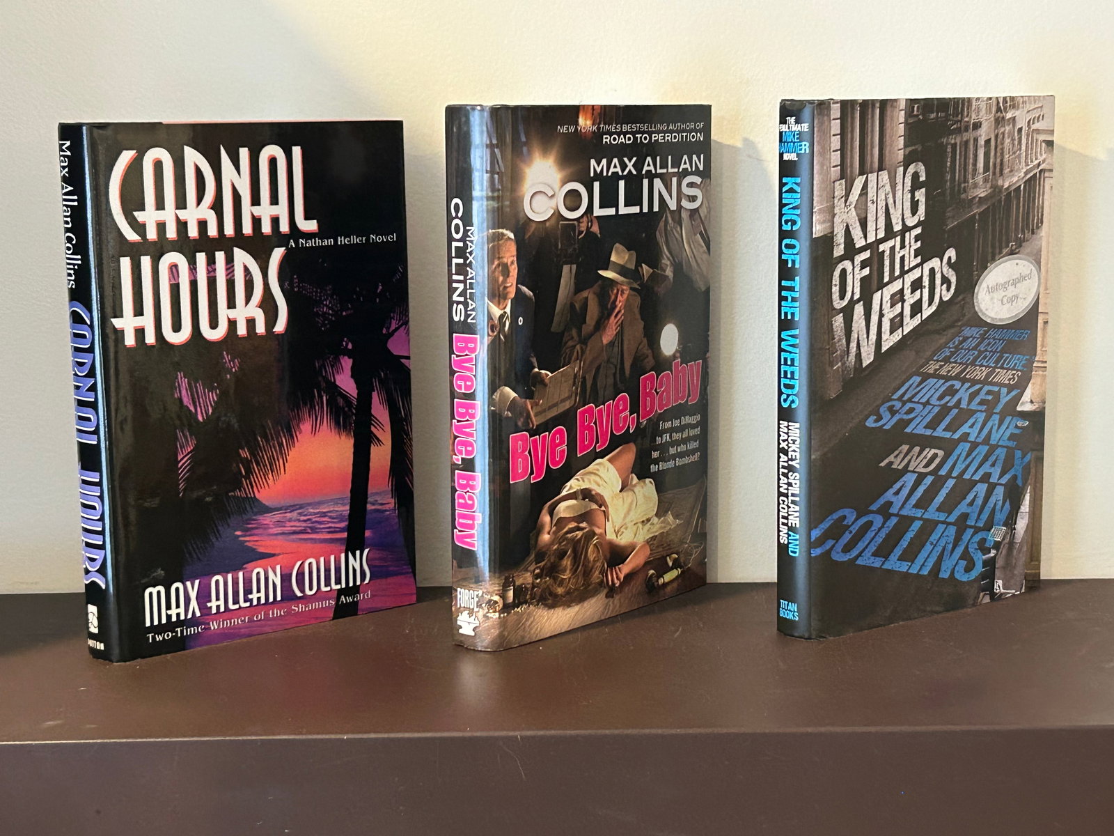 Max Allan Collins SIGNED First Editions: Carnal Hours, Bye Bye Baby & King Of The Weeds SIGNED First Editions published by Dutton, Forge & Titan Books, New York, 1994, 2011, 2014. Dimensions: 11" x 9" x 6"