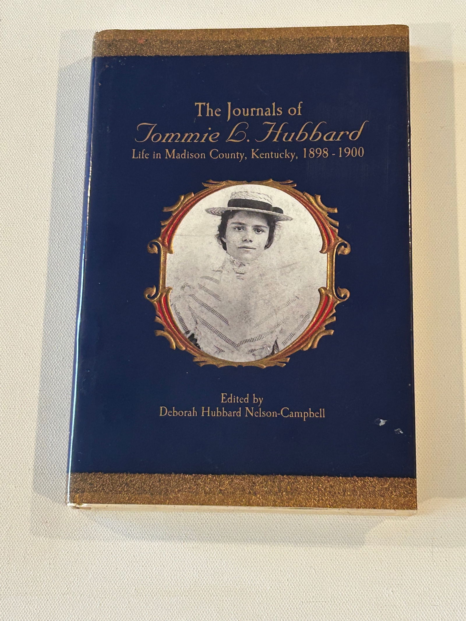 The Journals Of Tommie L. Hubbard by Deborah Hubbard Nelson-Campbell SIGNED First Edition: The Journals Of Tommie L. Hubbard by Deborah Hubbard Nelson-Campbell SIGNED First Edition SIGNED Twice published by Jesse Stuart Foundation, Ashland, 2003. Dimensions: 11" x 9" x 3"