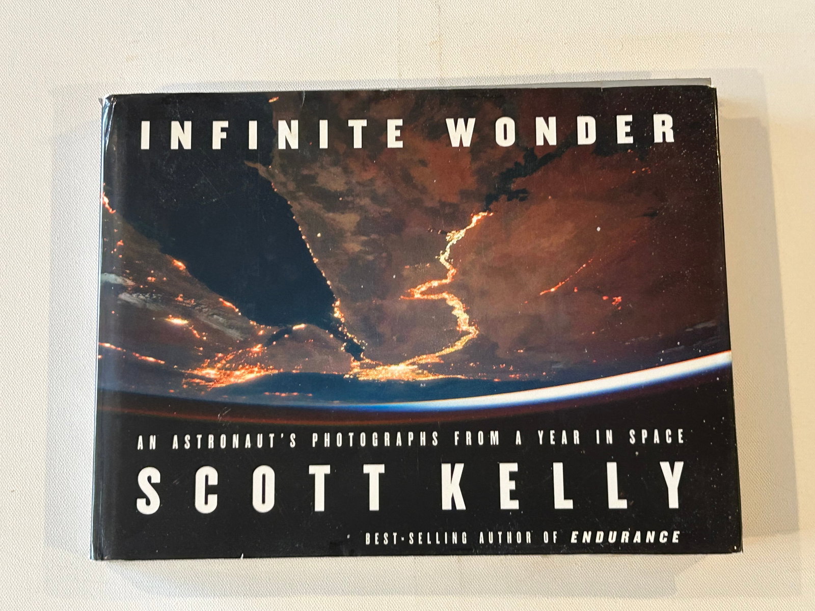 Infinite Wonder By Scott Kelly SIGNED First Edition: Infinite Wonder An Astronaut's Photographs From A Year In Space By Scott Kelly SIGNED First Edition published by Crown, New York, 2018. Dimensions: 16" x 9" x 3"