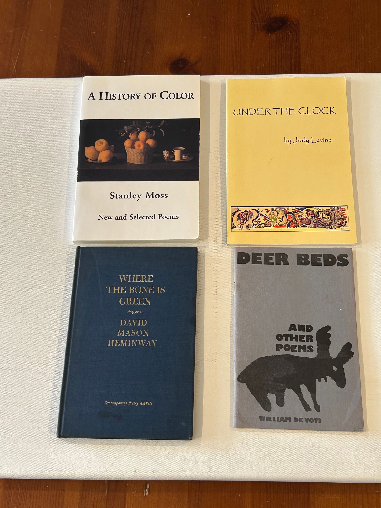 SIGNED Poetry Lot #1: Deer Beds And Other Poems by William De Voti. Where The Bone Is Green by David Mason Hemingway. Under The Clock by Judy Levine. A History Of Color New And Selected Poems by Stanley Moss. Dimensions: 1