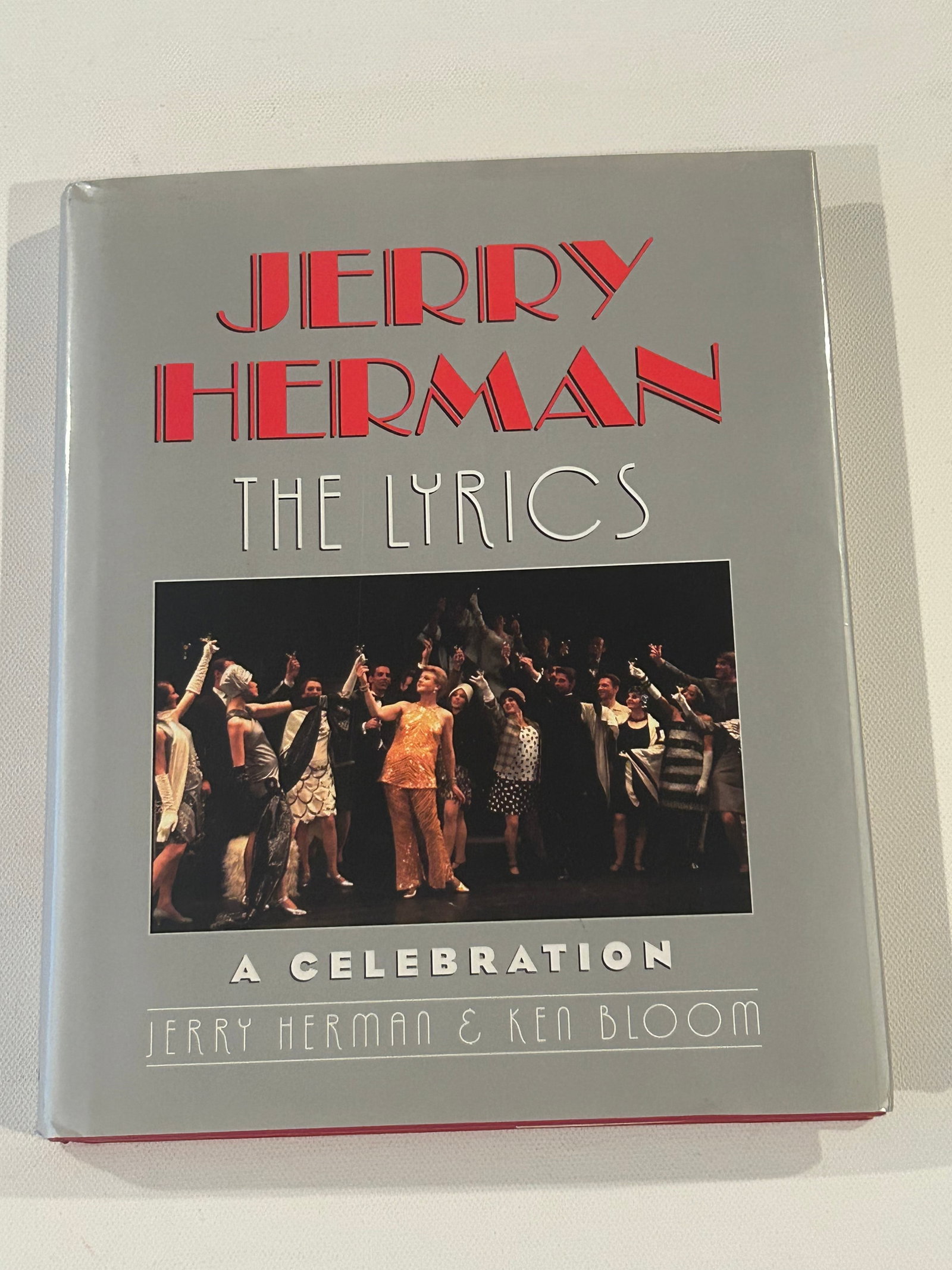 Jerry Herman: The Lyrics A Celebration SIGNED & Inscribed by Jerry Herman First Edition: Jerry Herman: The Lyrics A Celebration by Jerry Herman & Ken Bloom SIGNED & Inscribed by Jerry Herman First Edition published by Routledge, New York, 2003. Dimensions: 11" x 9" x 3"