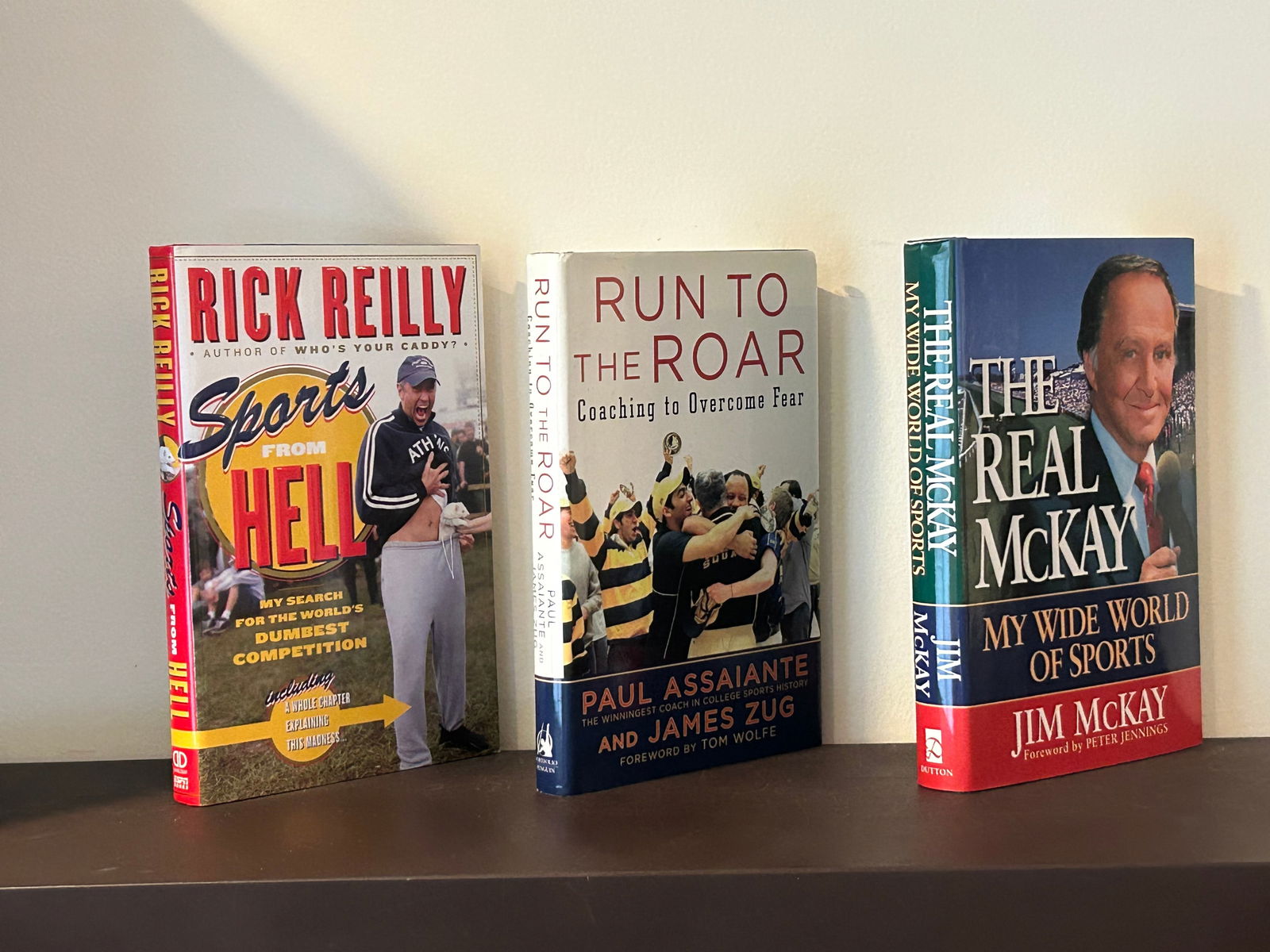 Sports Themed SIGNED Editions: The Real McKay by Jim McKay SIGNED & Inscribed First Edition. Run To The Roar by Paul Assaiante SIGNED Second Printing. Sports From Hell by Rick Reilly SIGNED First Edition Dimensions: 11" x 9" x 6"