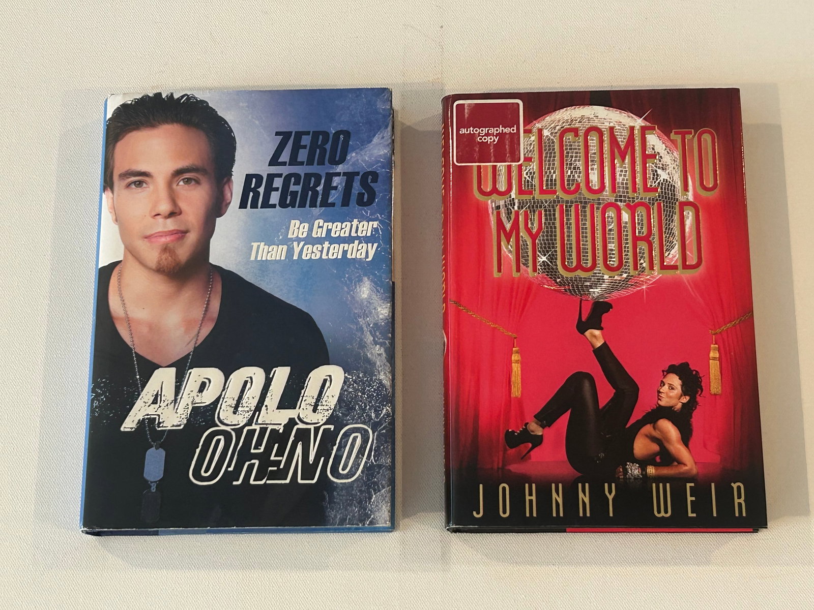 Ice Skating Themed SIGNED First Editions - Apolo Ohno & Johnny Weir: Zero Regrets by Apolo Ohno McKay SIGNED First Edition. Welcome To My World by Johnny Weir SIGNED First Edition Dimensions: 11" x 9" x 6"