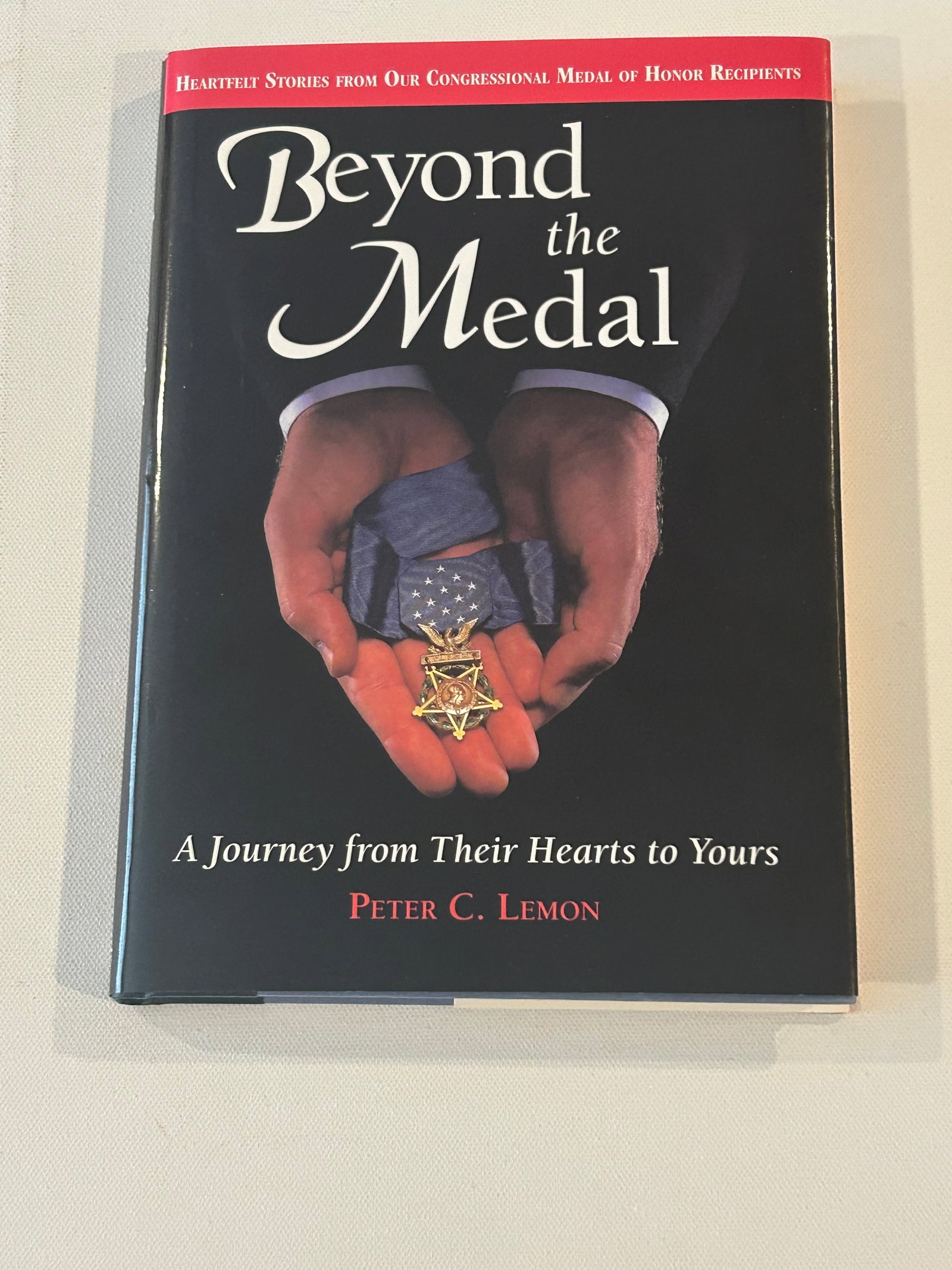Beyond The Medal by Peter C. Lemon SIGNED & Inscribed Later Printing: Beyond The Medal A Journey From Their Hearts To Yours by Peter C. Lemon SIGNED & Inscribed Later Printing published by Fulcrum Publishing, Golden, 1997. Dimensions: 11" x 9" x 3"