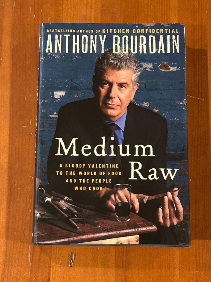 Medium Raw by Anthony Bourdain SIGNED & Inscribed First Edition: Medium Raw Bloody Valentine To The World Of Food And The People Who Cook by Anthony Bourdain SIGNED & Inscribed First Edition published by Ecco/Harper Collins, New York, 2010. Dimensions: 11" x 9" x 3
