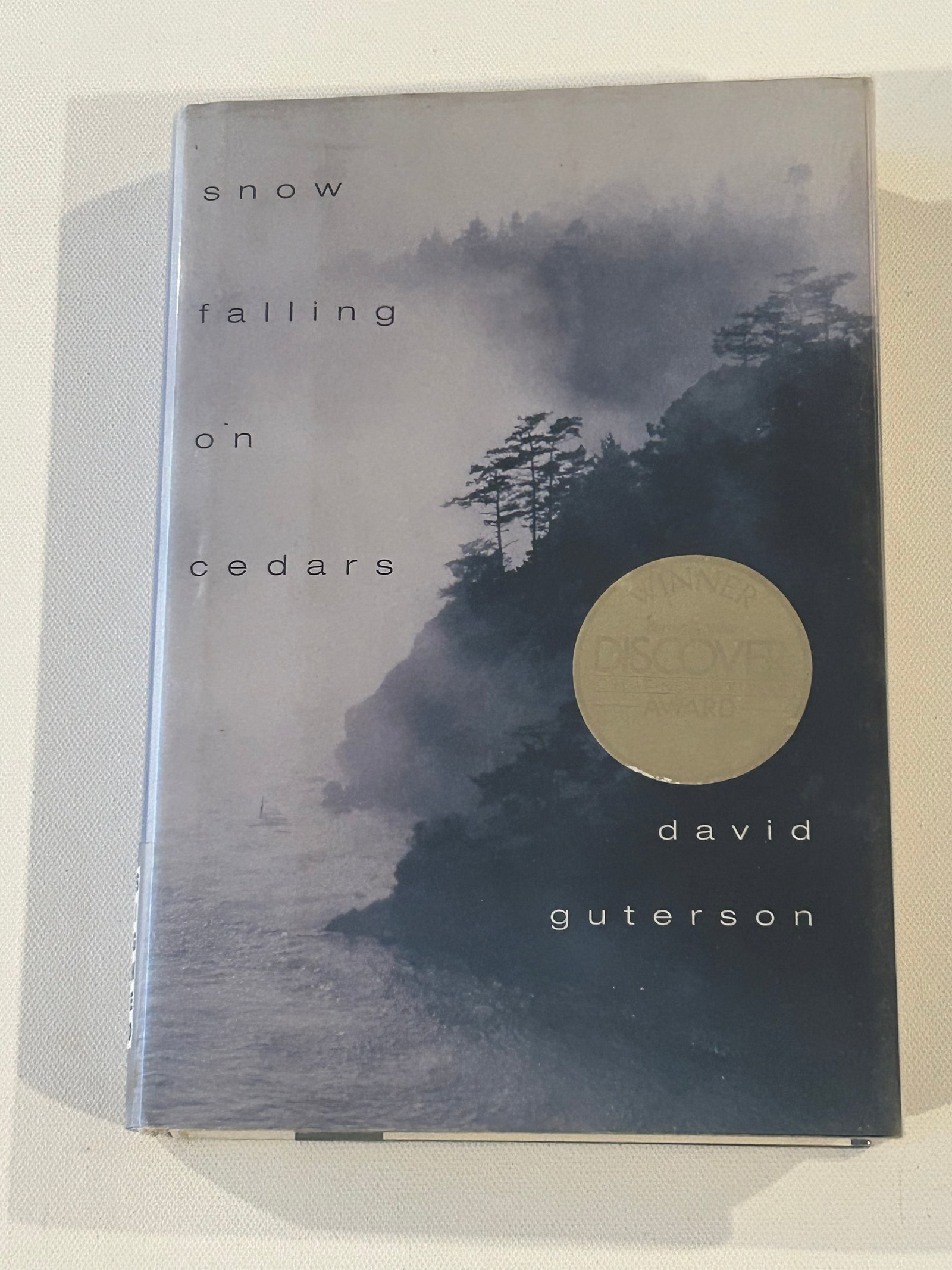 Snow Falling On Cedars by David Guterson SIGNED Fourth Printing: Snow Falling On Cedars by David Guterson SIGNED Fourth Printing published by Harcourt Brace & Co., New York, 1994. Dimensions: 11" x 9" x 3"