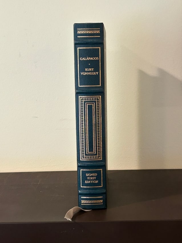 Galapagos by Kurt Vonnegut SIGNED Leather Bound Limited First Edition: Galapagos by Kurt Vonnegut SIGNED Leather Bound Limited First Edition published by The Franklin Library, Franklin Center, 1985.. Dimensions: 11" x 7" x 3"
