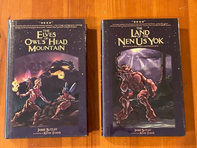 Jamie Sutliff SIGNED First Editions: The Land Of The New Us York & The Elves Of Owl's Head Mountain by Jamie Sutliff SIGNED by Sutliff & Illustrator Kevin Evans First Editions published by Cold River Publishing, Long Lake, 2007. Dimensio