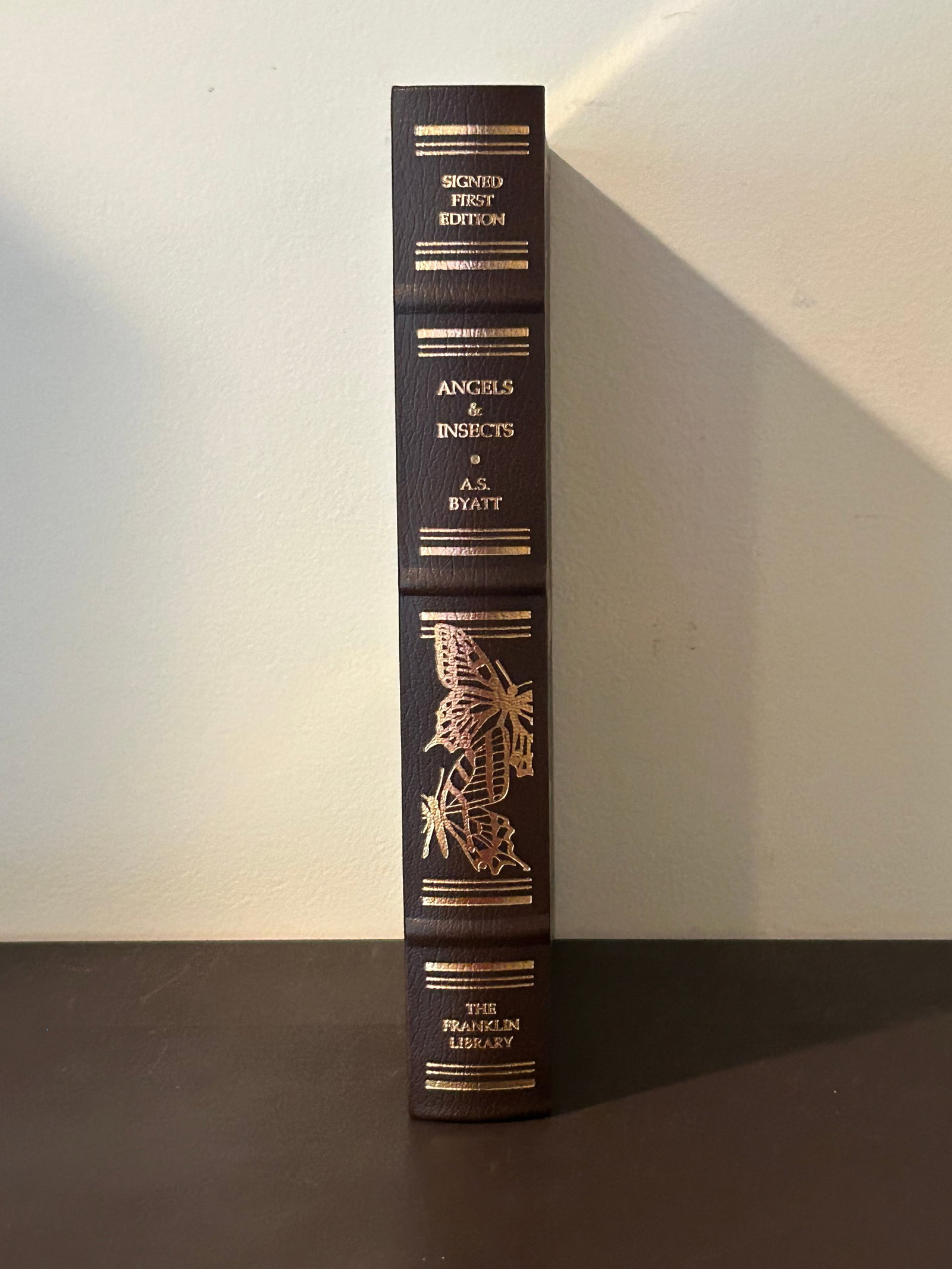 Angels & Insects by A. S. Byatt SIGNED Leather Bound First Edition: Angels & Insects by A. S. Byatt SIGNED Leather Bound First Edition published by The Franklin Library, Franklin Center, 1993. Dimensions: 11" x 9" x 2"