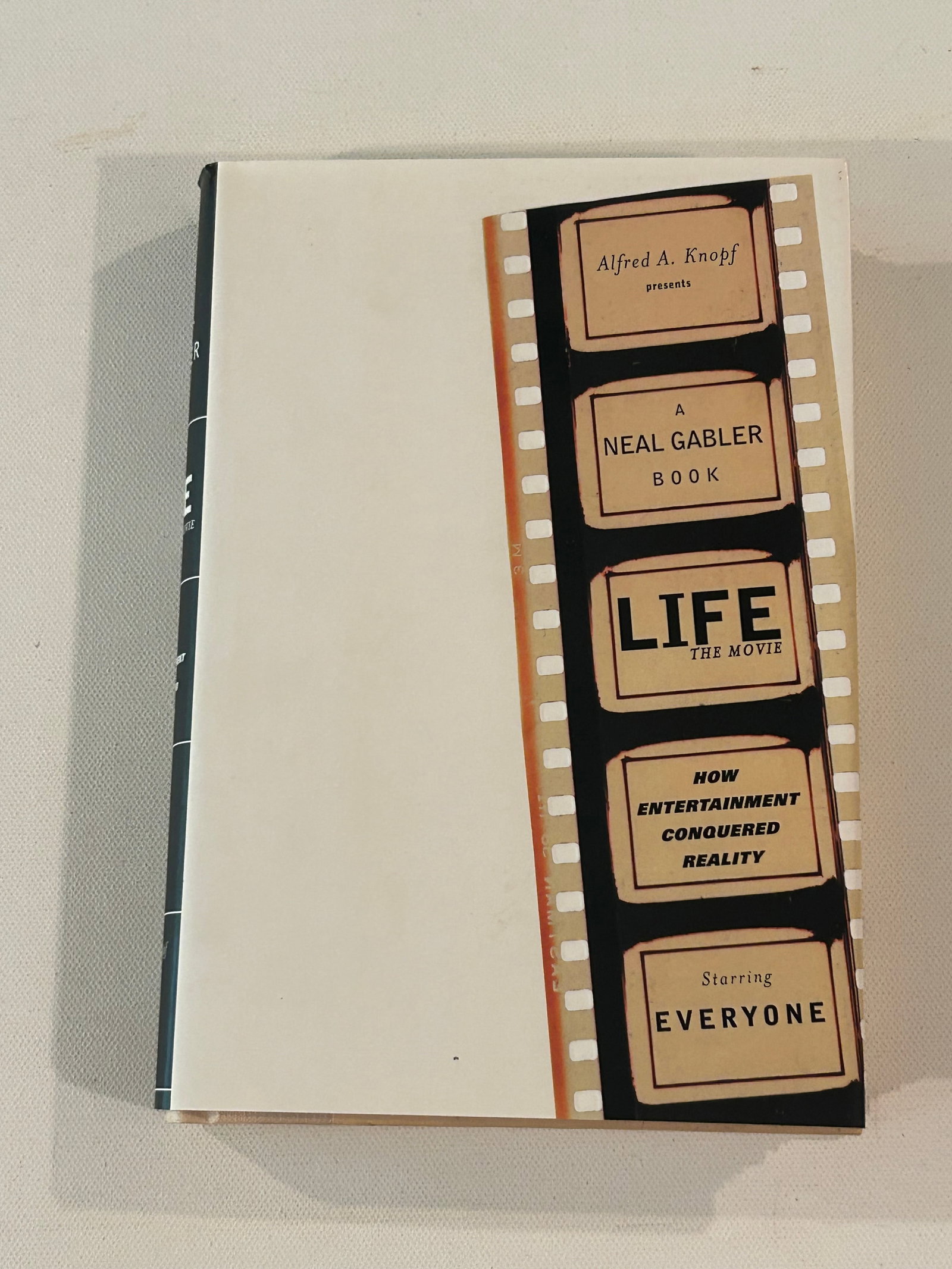 Life The Movie by Neal Gabler SIGNED & Inscribed First Edition: Life The Movie How Wntertainmen t Conquered Reality by Neal Gabler SIGNED & Inscribed First Edition published by Alfred A. Knopf, New York, 1998. Dimensions: 11" x 9" x 3"