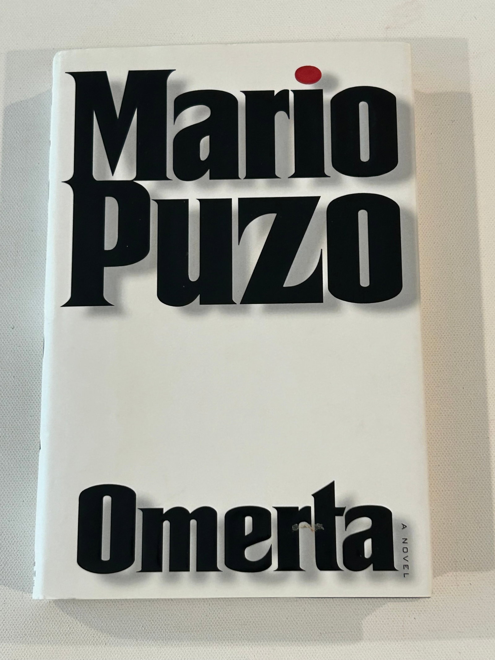 Omertà by Mario Puzo First Edition SIGNED & Inscribed by Puzo's Sister On Dedication Page: Omertà by Mario Puzo First Edition SIGNED & Inscribed by Puzo's Sister (Evelyn Murphy) On Dedication Page published by Random House, New York, 2000. Dimensions: 11" x 9" x 3"