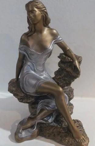 Statue by Alice Heath: Woman Seated on Rock: Seated Woman on Rock Statue by Alice Heath: Created in 1990, Retired. Pearl & Bronze Finish on Durastone for Austin Sculpture, NY. Titled "Memories" from the Fantasy & Romance Collection. Pensive Fema