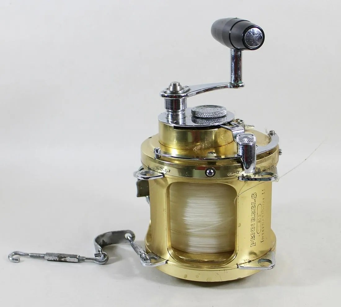 PENN INTERNATIONAL II GOLD 80S FISHING REEL: A Penn International Big Game gold standard fishing reel. It is Model 80S. It was made in USA and has Pat # 3478979 and the serial number engraved on the reel.