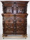 Flemish heavy carved oak court cupboard: Flemish heavy carved oak figural court cupboard with lion heads. 19th century. 82"h x 65"w x 22"d