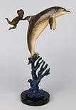 ROBERT WYLAND (USA B1956) BOY & DOLPHIN BRONZE: Robert Wyland (AMERICAN / CALIFORNIA / MICHIGAN, born 1956) bronze sculpture depicting a boy with dolphin and coral. Stands just under 15" tall. Signed and dated 1997. Mounted on black marble base.