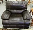 BASSETT LEATHER RECLINING OVERSIZED CHAIR: A Brown leather reclining chair by Basset Furniture. It measures 45" x 38" x 40".