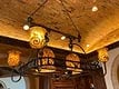 HANGING WROUGHT IRON LIGHTING FIXTURE: VINTAGE HANGING WROUGHT IRON HANGING LIGHTING FIXTURE WITH 6 TOBACCO LEAF TORTOISE SHELL STYLE BULBOUS DOME SHADES-APROX 54"L X 36"W