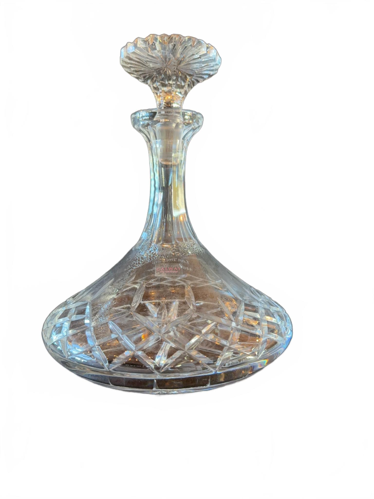 Cut Crystal Decanter with Stopper: Clear cut crystal decanter featuring an engraved inscription: 'Lone Tree Club 40 Year Member 2007.' Includes a matching crystal stopper. The decanter has a classic pattern with starburst and