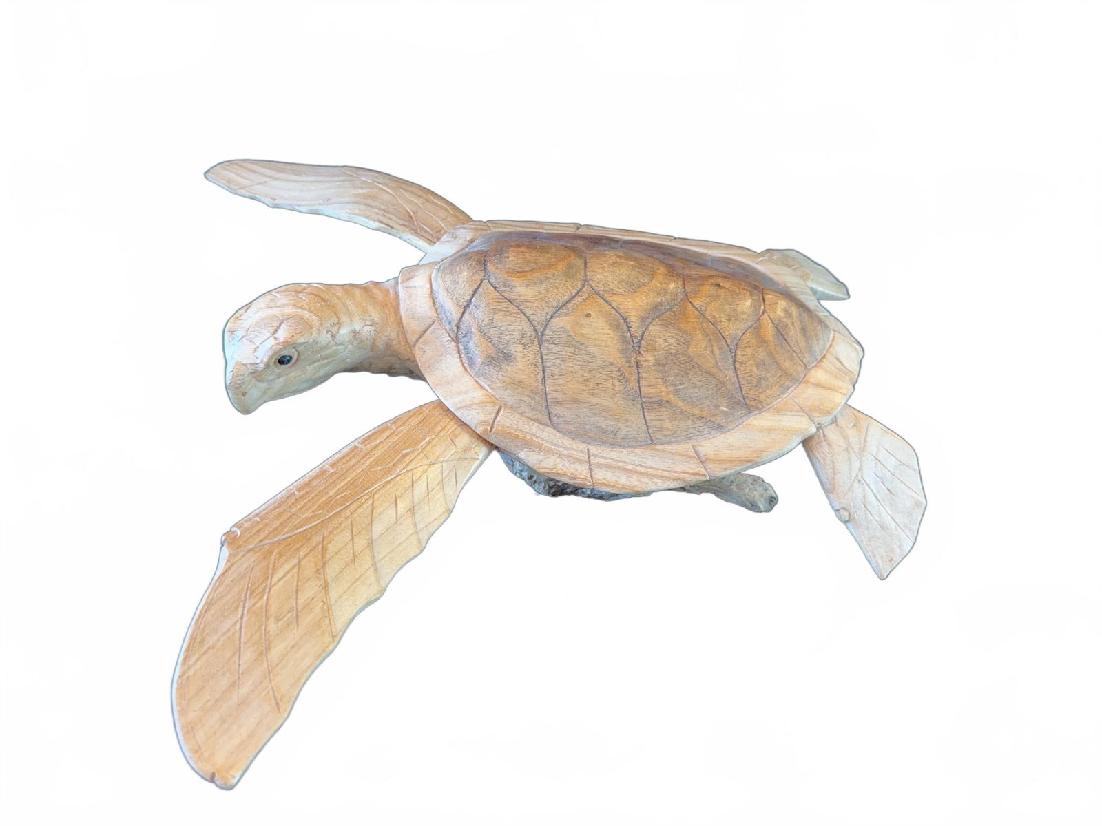 Hand-Carved Wooden Sea Turtle Sculpture: This detailed sea turtle sculpture is hand-carved from wood, featuring extended flippers and a textured shell. The figure is mounted on a naturalistic wooden base, highlighting the craftsmanship of