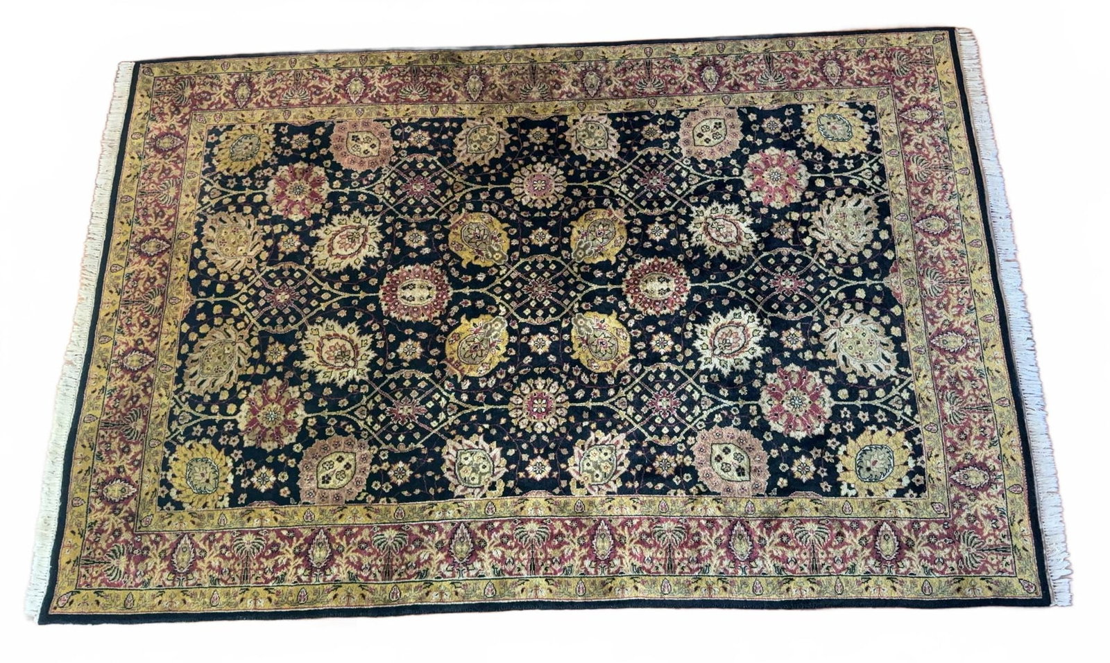 9' X 6' Oriental Rug - Hand-Knotted with Floral Motif: Hand-knotted Oriental Rug area rug featuring a central field of intricate floral and foliate patterns in gold, red, and cream on a black ground, with a wide gold and red floral border. The rug include