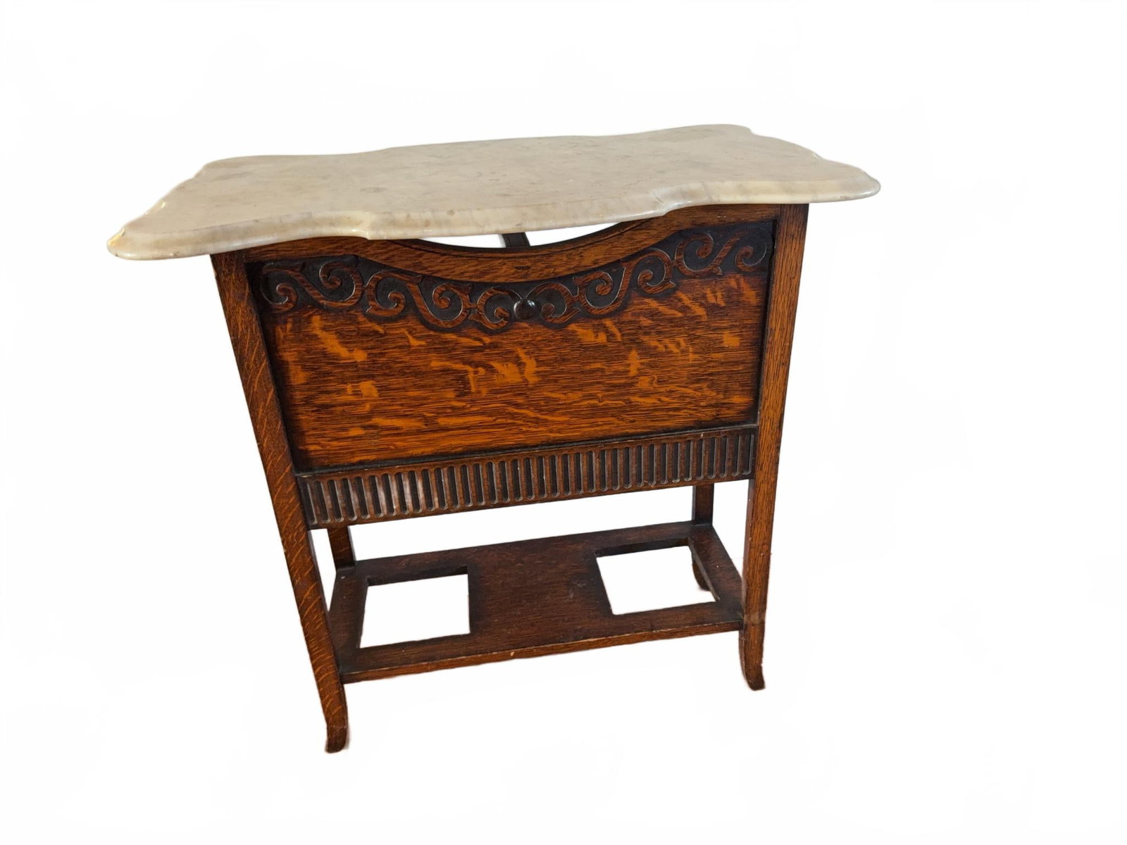 Marble Top Oak Washstand with Decorative Front: This washstand features an oak base with carved decorative detailing on the front panel and a shaped marble top. The design shows craftsmanship in both the woodwork and the stone, making it suitable f