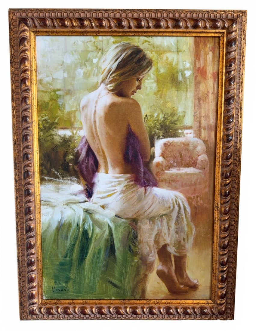 Vidan Limited Edition Giclee on Canvas, 18/195: This is a Limited Edition Giclee on Canvas, 18/195 signed by the artist. This custom framed work features seated woman with a draped cloth. The artwork is presented in an ornate gold tone frame and is