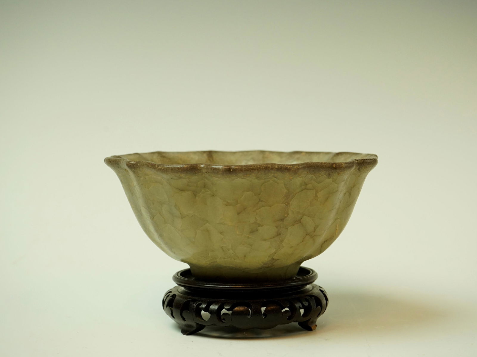 Rare Chinese Celadon Crackle Glazed Porcelain Bowl With Wooden Stand: DescriptionTitle: Rare Celadon Crackle Glazed Porcelain Bowl With Wooden Stand Origin: CHINESEDate/Period: 19c.Material: PORCELAINSize: Height: 3in/7.5cm, Bottom Diameter:7in/18cmAdditional Informatio