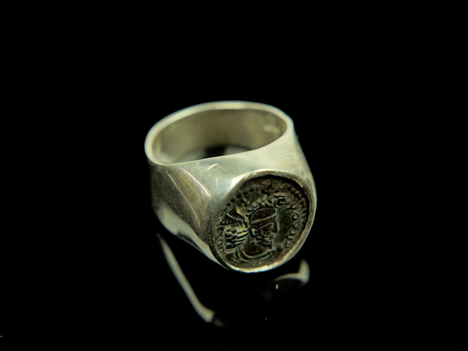 Kushanshah(Kushano-Sassanian) Coin Silver Ring: Origin:Iran Date/Period: 265-295B.C.E Material: 95% Silver Approximate Size: 10.7grams 16x25mm Size 8 Additional Information: Bronze unit,Obverse, bust of King in elaborate crown, with long ribbons.Re