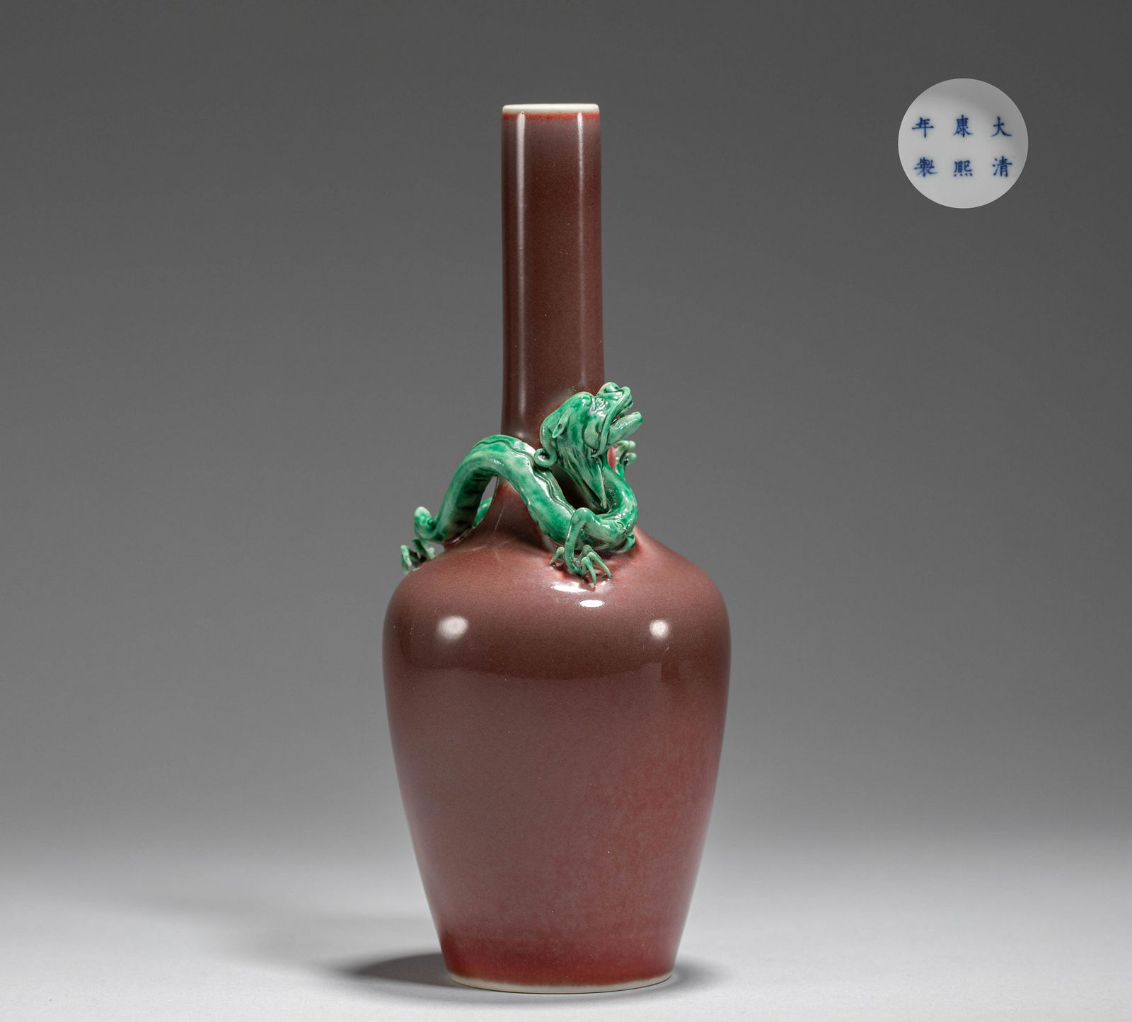 A SANG DE BOEUF-GLAZED BOTTLE VASE WITH TURQUOISE COILED DRAGON (1 of 7)