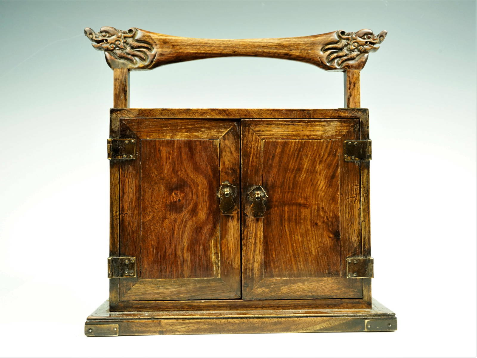 A Huanghuali Two Door Chest With Handle Auction