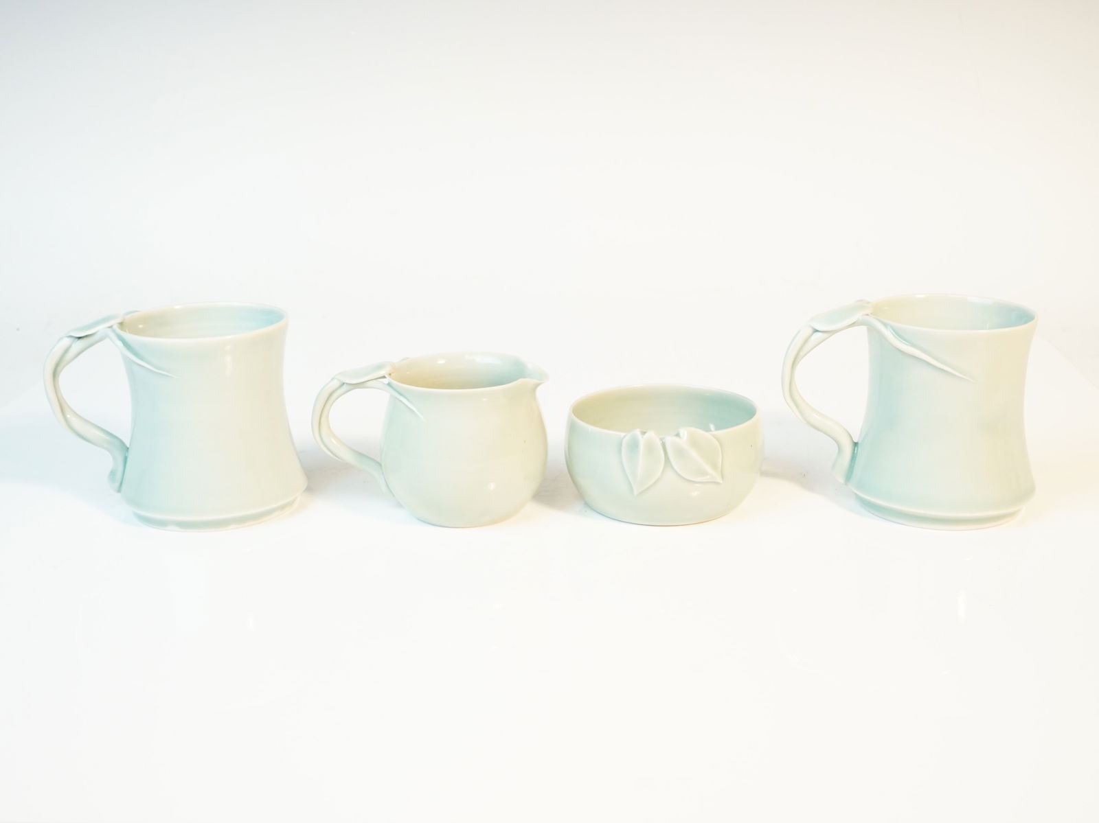 Four Pieces Of Vintage Porcelain Vine Design By Caroline Mckinney,20Th C: Approximate size:Height 3.25in/3.25in/2in/1.75in Shipping: We offer in-house shipping services for most small items. This means that we will take care of packing and shipping the items directly to you